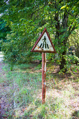 Old rusty metal signs in the Chernobyl zone. Radioactive area. Warning about dangerous area