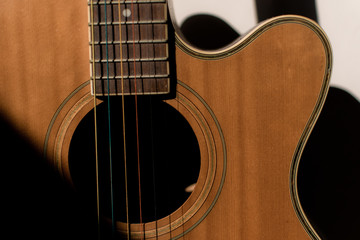Obraz premium Close-up guitar with half sun highlight and shadow