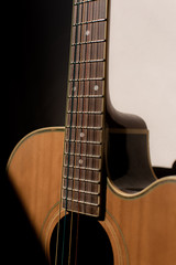 Fototapeta na wymiar Close-up guitar with half sun highlight and shadow