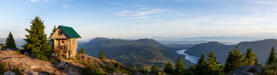 View of Tin Hat Cabin on top of a mountain during a sunny summer evening. Located near Powell...