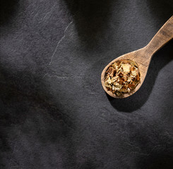 Dried leek in wooden spoon - Allium ampeloprasum var. porrum
