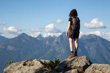 Naklejka na ściany i meble Adventurous Girl Hiking on top of Tin Hat Mountain, part of the popular Sunshine Coast Hiking Trail in Powell River, British Columbia, Canada. Concept: Explore, Adventure, Travel