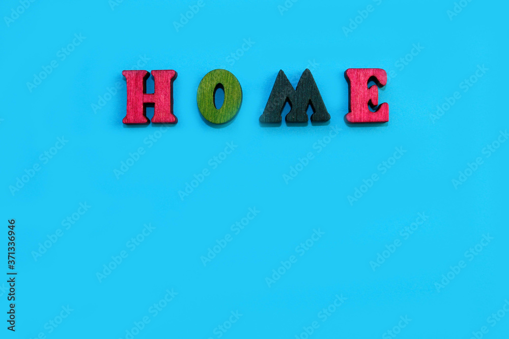 Fototapete the letters of the alphabet are laid out on a blue background in the form of a word.
