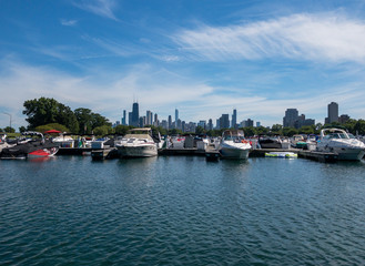 Fototapeta na wymiar view of downtown Chicago skyline past Diversey Harbor boats in Chicago, Illinois