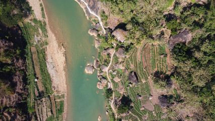 Aerial view of the Oyo river with rice terraces on the hill