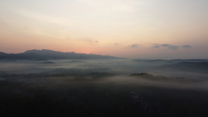 Aerial view of sunrise with light mist. Mount Ireng Gunungkidul Yogyakarta