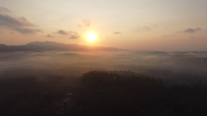 Aerial view of sunrise with light mist. Mount Ireng Gunungkidul Yogyakarta