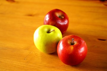 red apples on wooden table