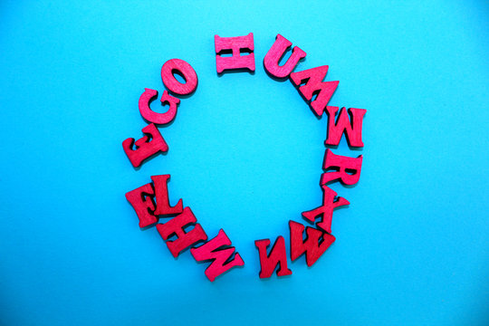 The letters of the alphabet are laid out on a blue background in the form of a circle.