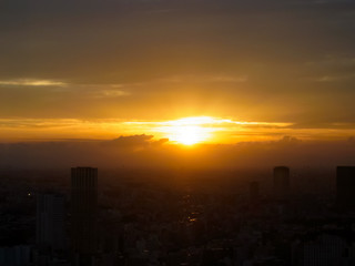 The sun which sets over there of the big city