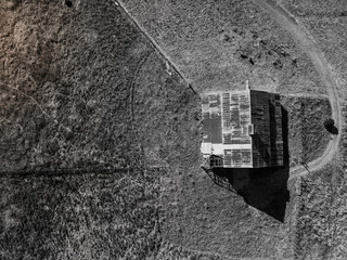 Monochrome Farmhouse on Dirt, Aerial Drone View