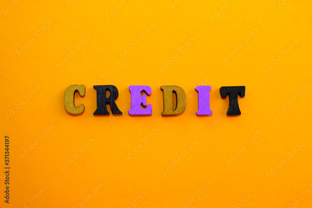 Fototapete the letters of the alphabet are laid out on an orange background in the form of a word.