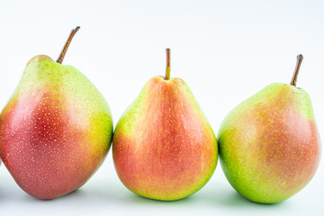 Fresh red crispy pears on white background