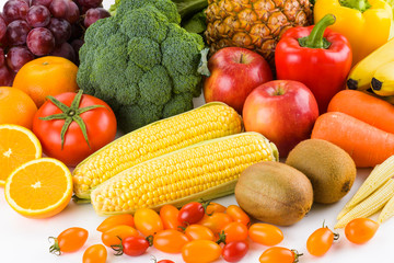Variety of fresh fruits and vegetables on white background