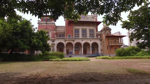 Old Palacio das Industrias Building, Catavento Science Museum, Sao Paolo Brazil. Historic Building and Landmark Behind Trees
