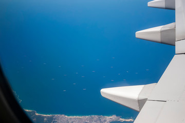 Fototapeta premium Looking out the window of a plane
