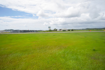 Greenfield of an airport in a bright sunny day