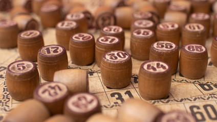 Old Wooden Lotto barrels with playing cards. Table Game Bingo