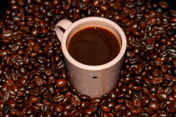 Background of coffee mugs and freshly roasted coffee beans