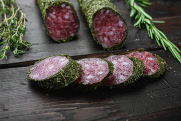 Traditional sausage salami fuet, cut to slices on old wooden table