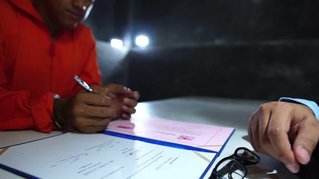 Footage 4K: Prisoners write papers before they are freed from prison