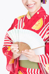 扇子と浴衣姿の女性