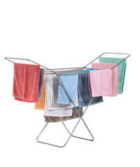 Clothes dryer with clean towels on white background