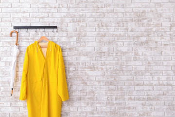 Raincoat and umbrella in hallway