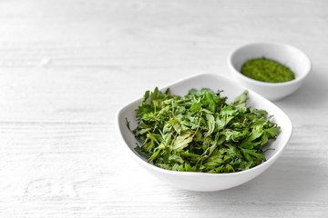 Healthy dry parsley on wooden table