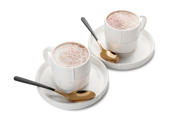Cups of hot coffee on white background