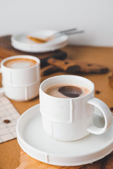 Cup of hot coffee on table