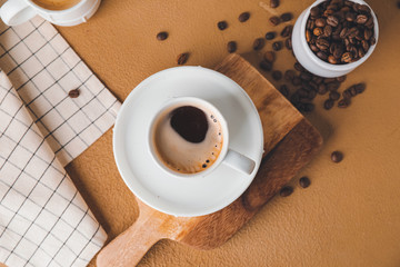 Cup of hot coffee on color background
