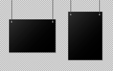Blanks of black paper hanging on threads. A4 blank paper.