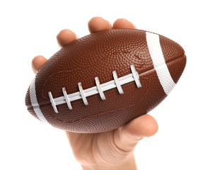 Male hand with rugby ball on white background