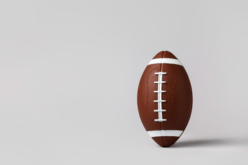 Rugby ball on grey background