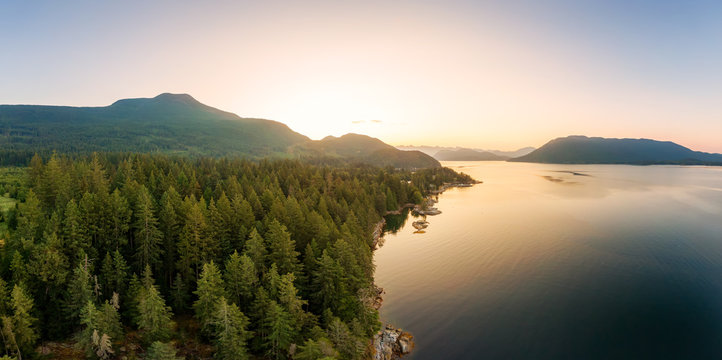 Aerial Panoramic View of Mermaid Cove during a colorful summer sunrise. Taken in Saltery Bay, Sunshine Coast, British Columbia, Canada.
