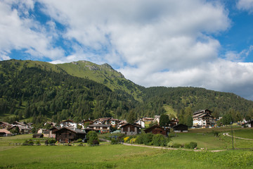Fototapeta na wymiar Panoramic view of Bellamonte mountain village in the summer season, Trentino, Italy
