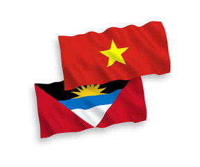 Flags of Antigua and Barbuda and Vietnam on a white background