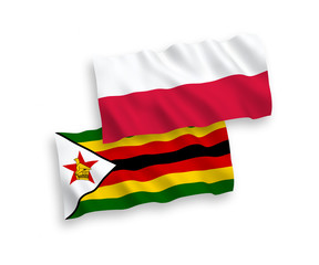 Flags of Zimbabwe and Poland on a white background