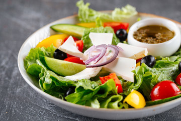 Greek salad with fresh vegetables cheese and olive