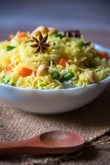 Indian style pulao rice with vegetables in a bowl.