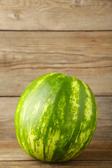 Fresh watermelon on the grey wooden background.