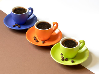 Colored cups of coffee with coffee beans on a white-brown background with copy space.