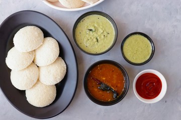South Indian breakfast dish Idli with Coconut Chutney and sambar. Idly sambar. over light background with copy space.