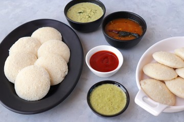 South Indian breakfast dish Idli with Coconut Chutney and sambar. Idly sambar. over light background with copy space.