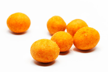 roasted chili nuts on white background