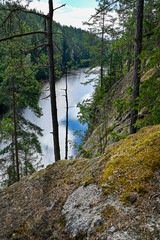 Fototapeta na wymiar Overlooking a little lake from a mountain in Sweden