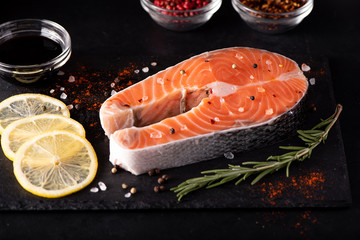 raw salmon steak with lemon and spices