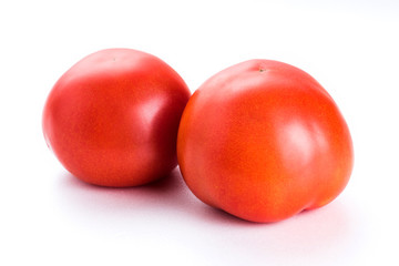 The red tomatoes on white background