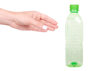 Hand with green colored water bottle, isolated on white background.